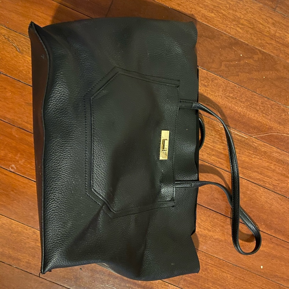 Black faux leather handbag with floral lining